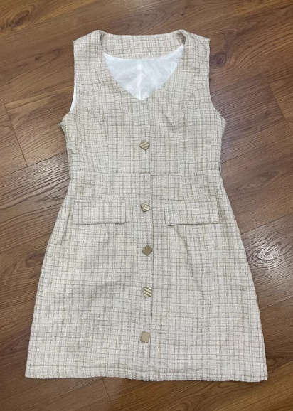 Stylish and slimming sleeveless vest dress with a touch of Chanel-inspired design; features a checkered pattern and a flattering waist-cinching design.– 6521